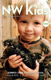 young boy holding chicken