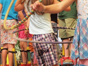 kids in a crowd hula hooping