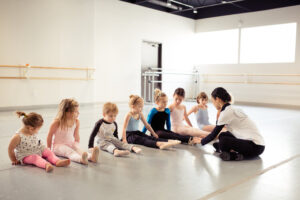 Director Xuan Cheng with ballet students.